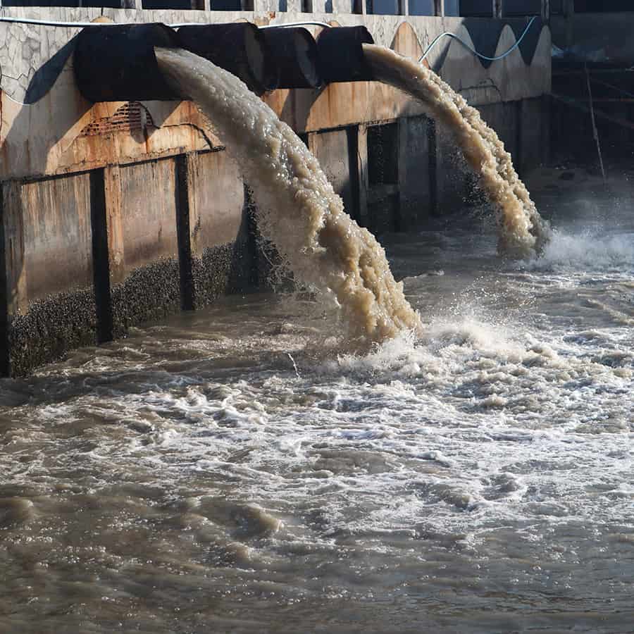 Industrial and factory waste water discharge pipe into the canal ...